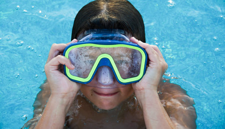 Little boy wearing an Underwater mask in swimming poolの写真素材