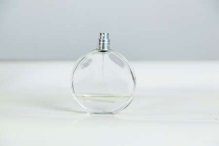 perfume on the white desk on gray background