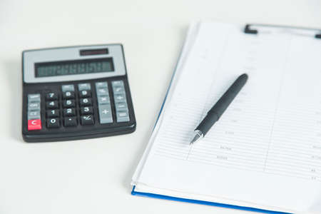 calculator and document on the table backgroundの写真素材