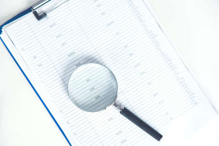 magnifier on document on the table background