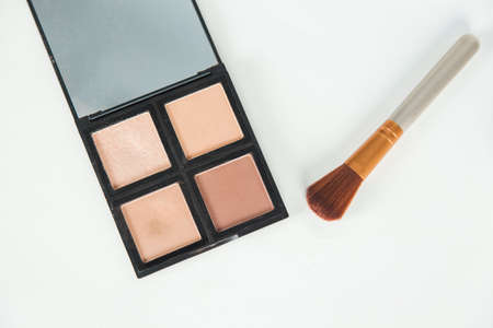 makeup powder and brush on the deskの写真素材