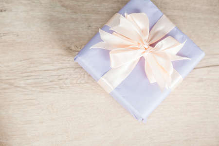 gift box on the wooden desk backgroundの写真素材