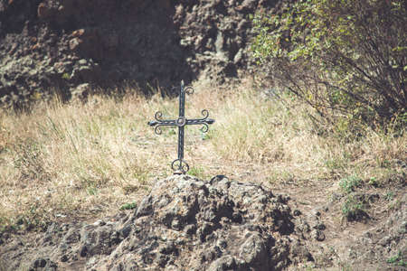 iron cross in the graaen grass natureの写真素材