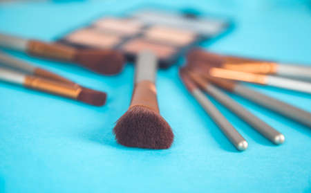 brushes and makeup accessories on the deskの写真素材