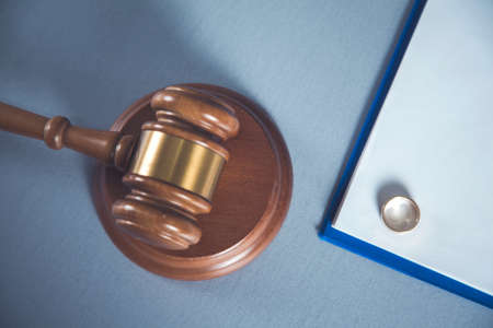 ring on document with judge on deskの写真素材