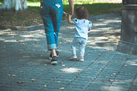 mother and daughter in garden  background