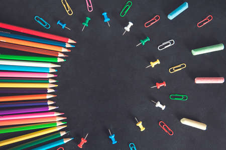 colorful pencils with stationary on the chalkboardの写真素材