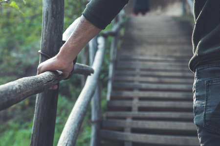 man climb the stairs in the nature
