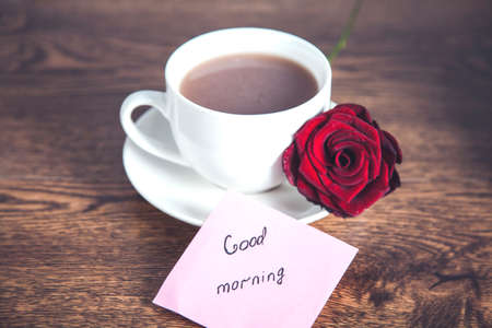 good morning text with cup of coffee and rosesの写真素材