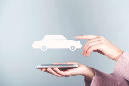 hand phone with car model in screenの写真素材