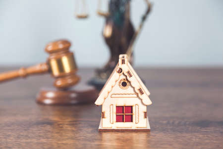 house model with judge and justice lady on desk