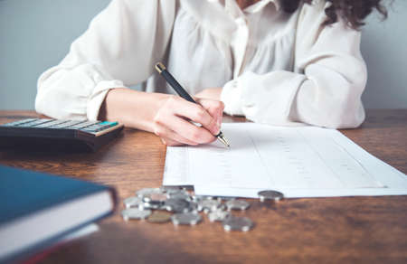 business woman hand documents in office deskの写真素材