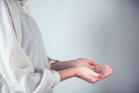 woman empty hands on grey backgroundの写真素材