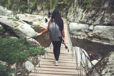 traveler young woman in the bridgeの写真素材