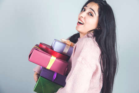 happy young woman hand different gift boxesの写真素材