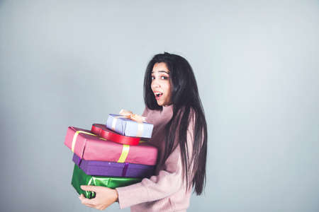 happy young woman hand different gift boxesの写真素材