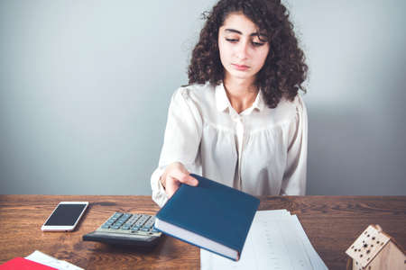 business woman hand notepad in office desk