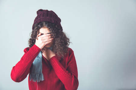 ill woman Flu on the gray wall backgroundの写真素材