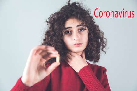 pill in woman hand. Coronavirus. 2019-nCoVの写真素材