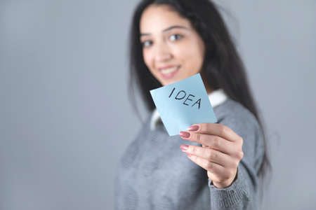 idea text on paper on woman handの写真素材