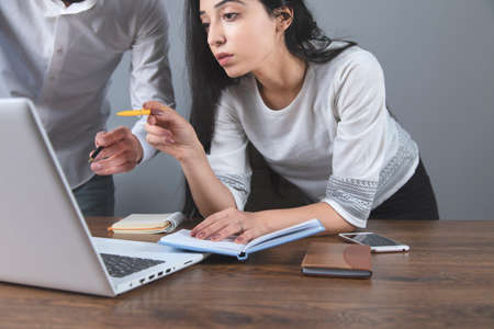 business man and woman working in office deskの写真素材