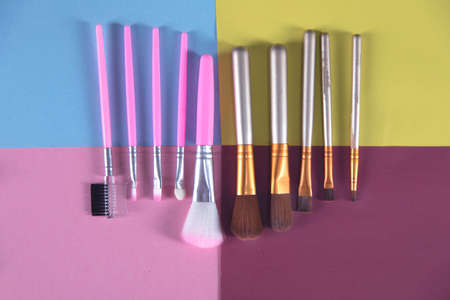 makeup brushes on the color  table background