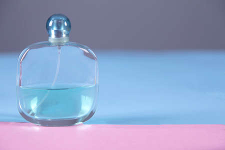 bottle of perfume on the color table background