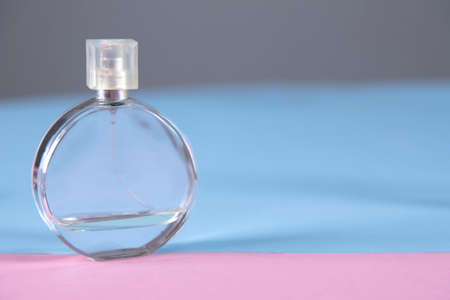 bottle of perfume on the color table backgroundの写真素材