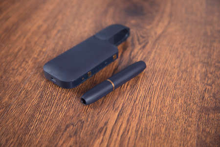 blue electric cigarette on the table background