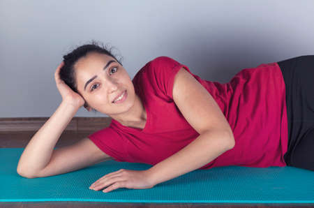 exercising young woman in carpet