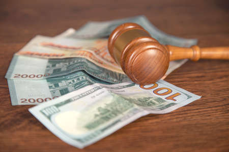 judge and money on the wooden tableの写真素材