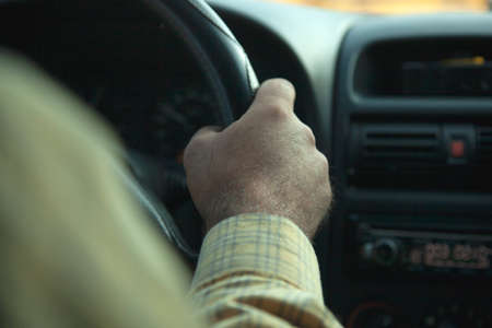 man drive a car in street backgroundの写真素材