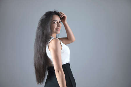 young beautiful fashion woman in studio backgroundの写真素材