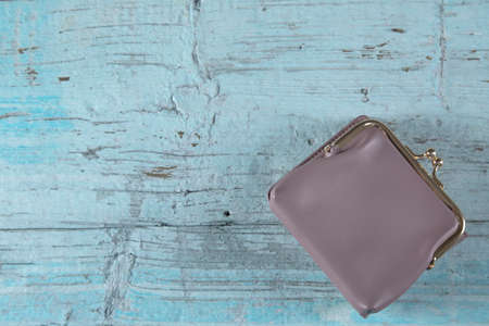 woman purple wallet on the table backgroundの写真素材