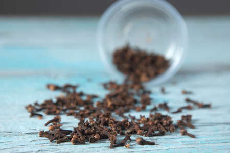 cloves on the blue and vintage table backgroundの写真素材