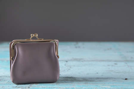 woman purple wallet on the table backgroundの写真素材
