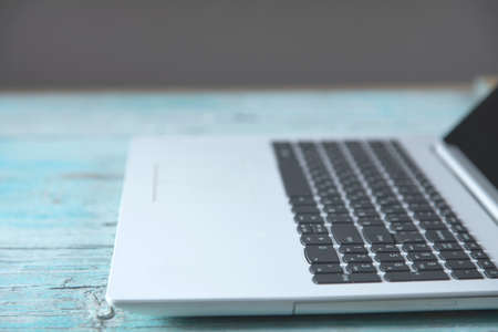 white notebook on the blue wooden table background