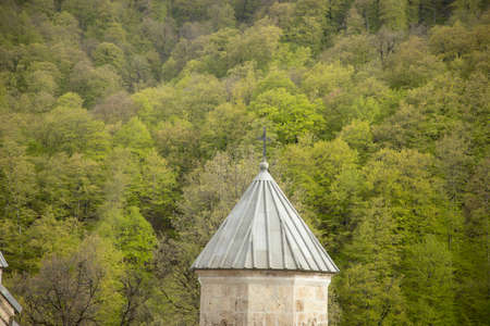 Haghartsin church in Armenia under abstract sky backround