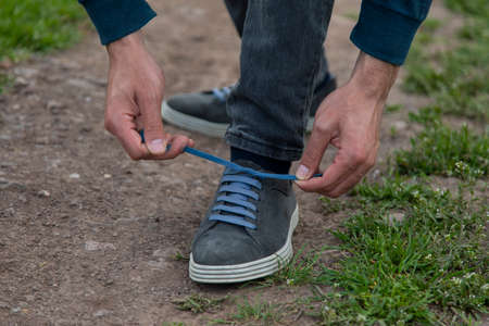 man tie sport shoelaces in nature backgroundの写真素材
