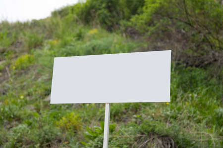 white signboard in the green nature background