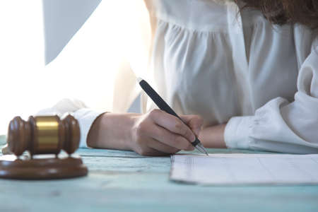 woman Judge working in document on the table
