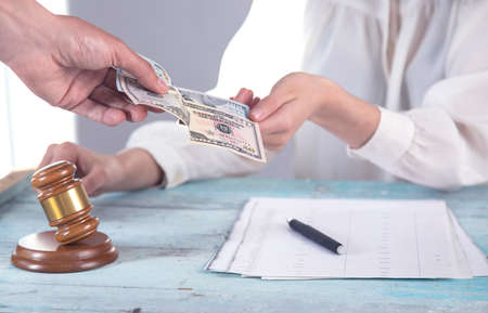man hand money and Judge on table background