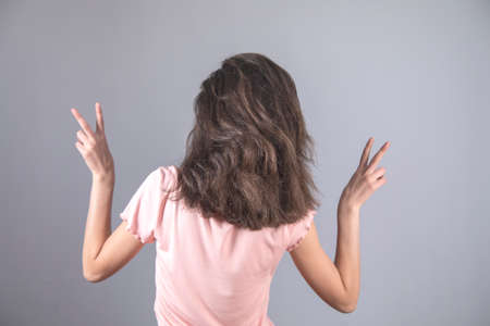 happy and young woman in the studio background