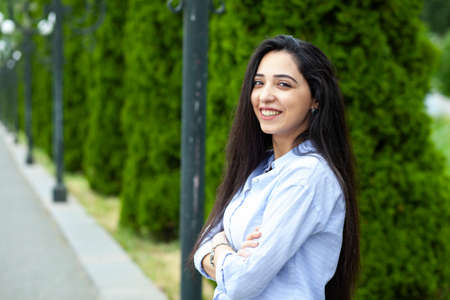 happy young woman in the street background