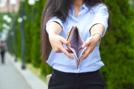 woman hand empty wallet in the street