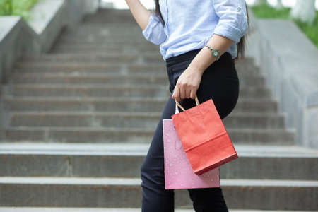 woman hand shopping bag in the street