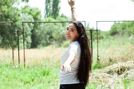 young and happy woman in the gardenの写真素材