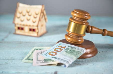 house model and money with judge on the tableの写真素材
