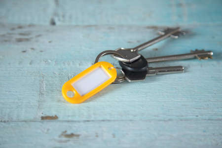 house key on the blue wooden tableの写真素材