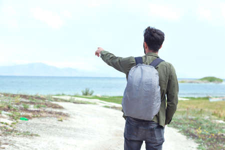the traveler man in the sea backgroundの写真素材